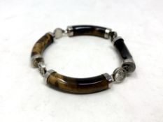 A Chinese white metal and polished stone bracelet