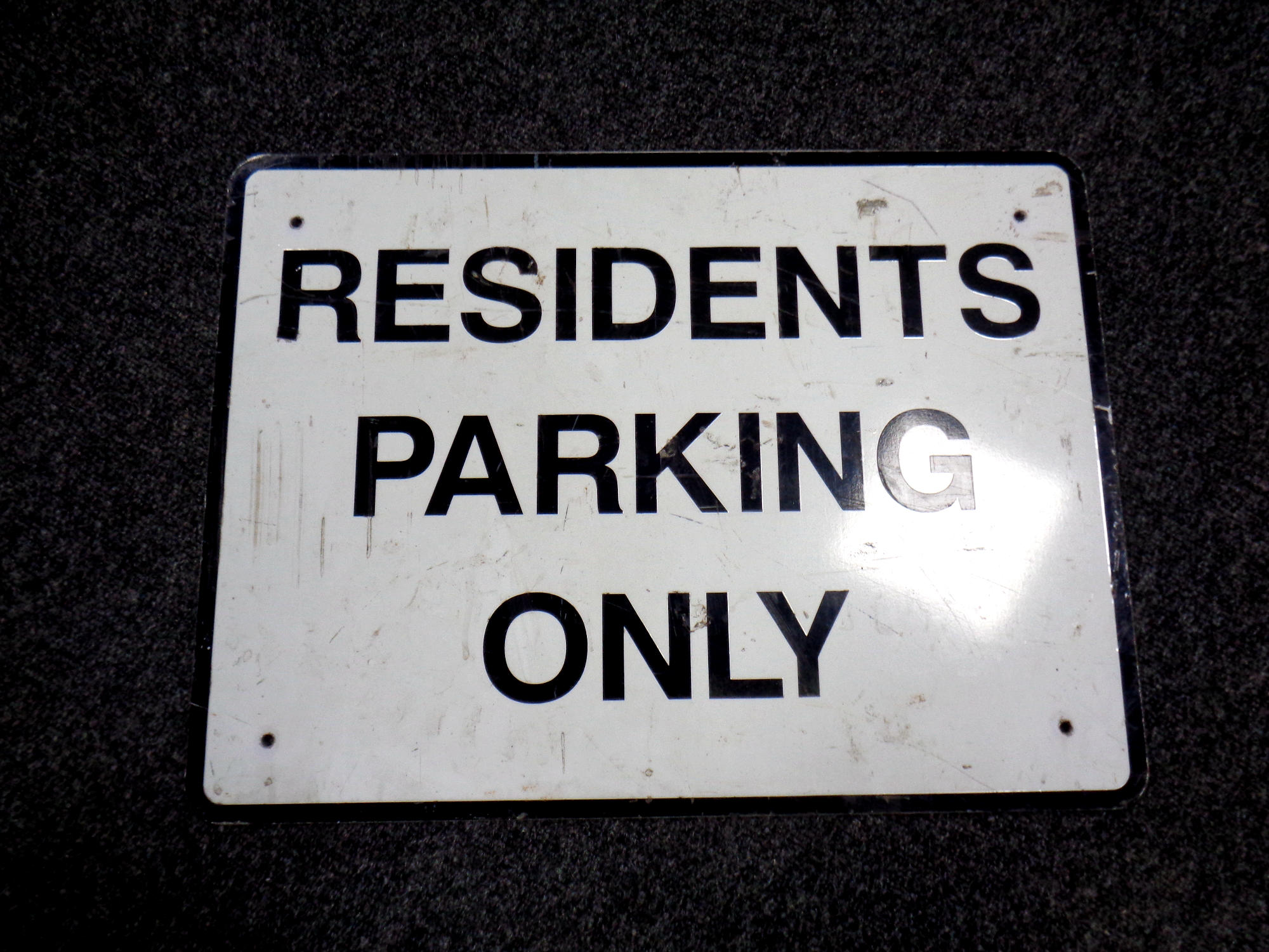 A metal Residents Parking Only sign