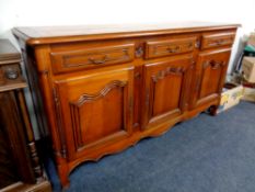 A good quality Victorian style triple door sideboard, fitted with three drawers, width 190 cm.