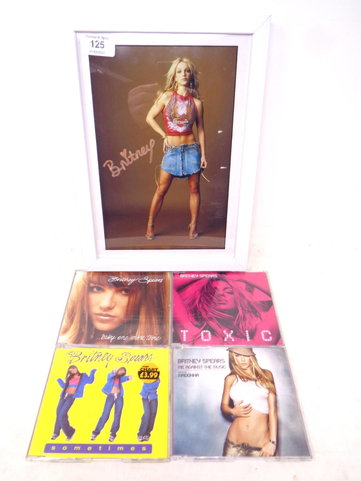 Britney Spears signed photo, mounted and framed, with cd singles - Baby one more time, Sometimes,