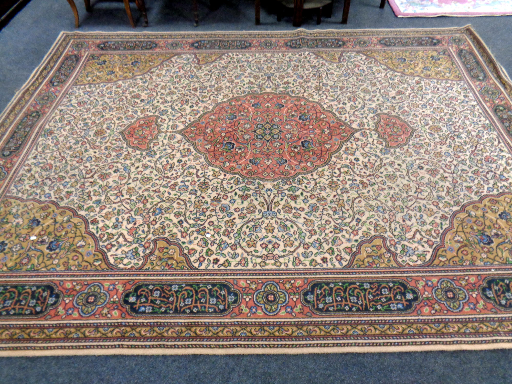 A machined carpet of Tabriz design,