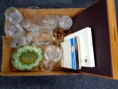A box of glass ware, paperweights, coronation plates, canteen of Oneida flexfit cutlery,