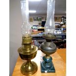 An Alladin brass oil lamp with chimney together with a further oil lamp with ceramic base with