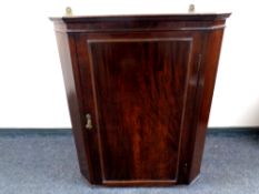 A 19th century mahogany corner cabinet