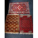 Three eastern rugs
