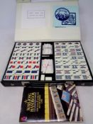 A cased Mahjong set together with a hand book