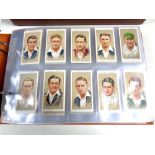 An album of players and Wills cigarette cards, flags,