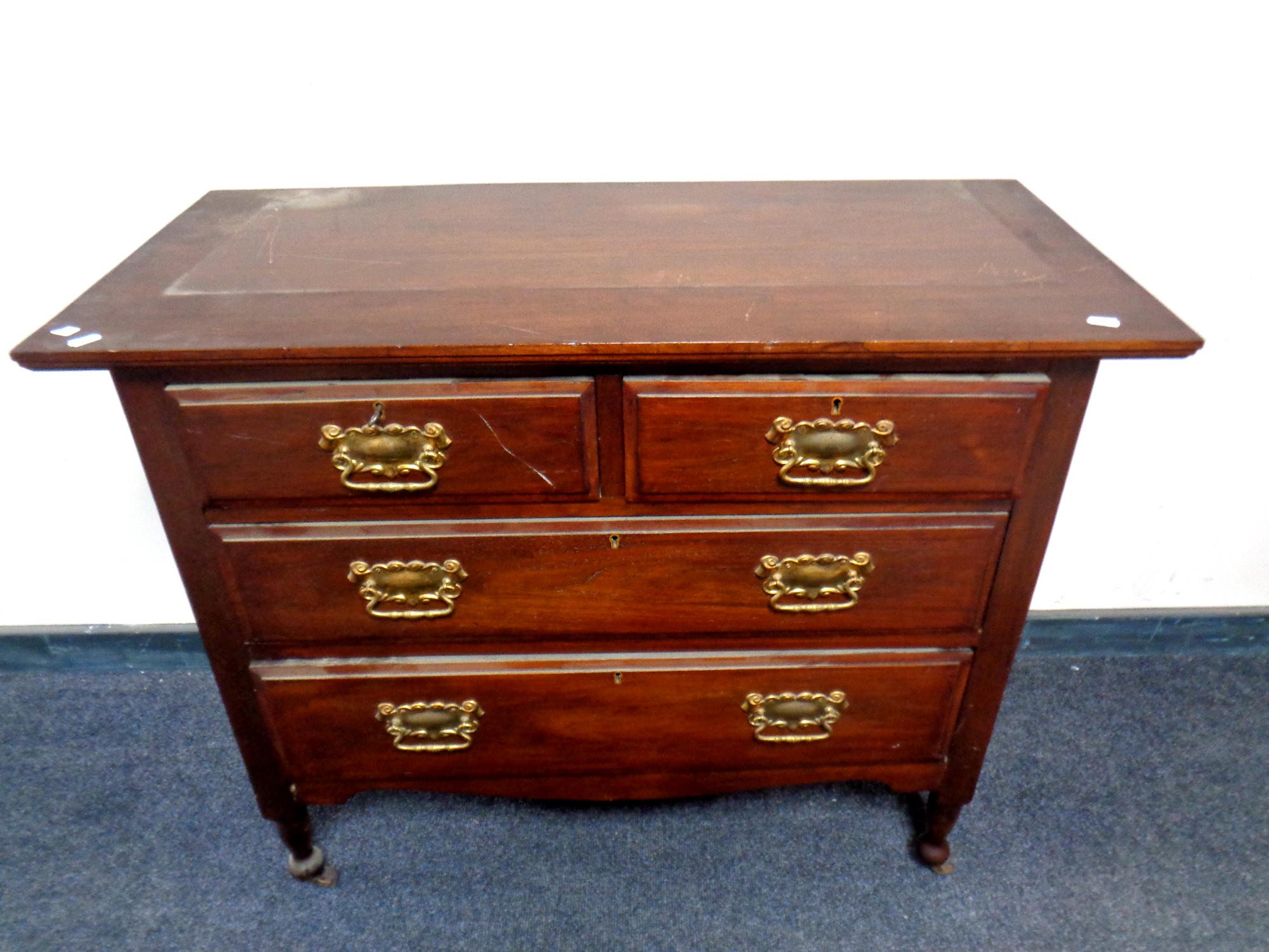 An Edwardian four drawer chest