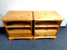 A pair of pine end tables fitted a drawer and shelves