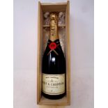 A bottle of Moet & Chandon champagne in fitted wooden box