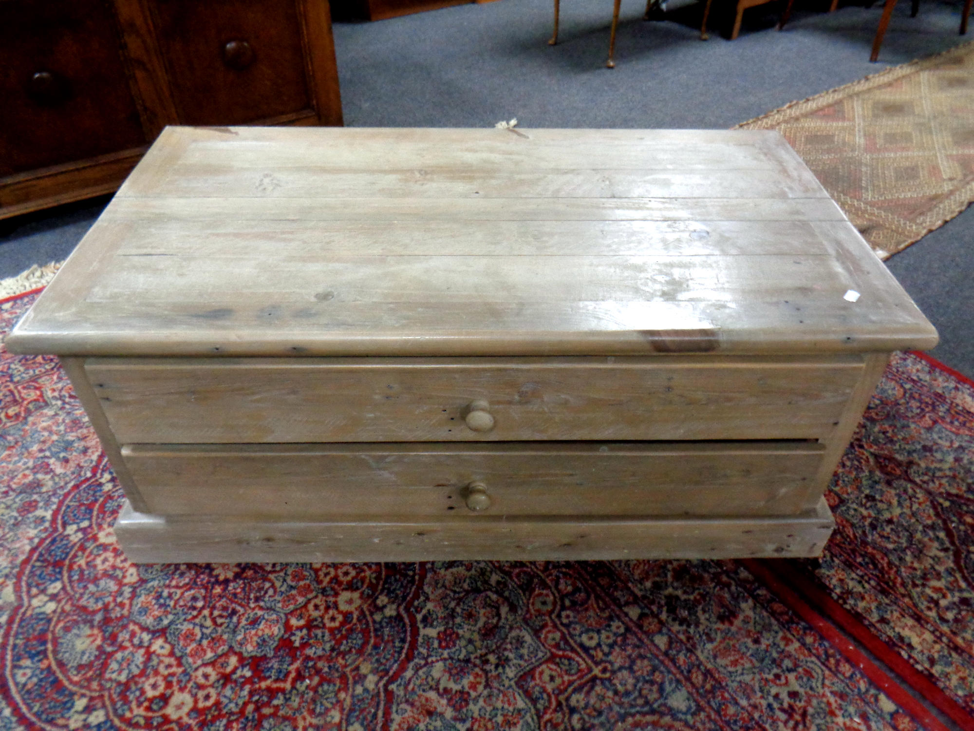 A pine coffee table fitted with four drawers, width 109 cm.