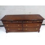 A Stag Minstrel eight drawer chest, width 156 cm.