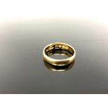 An 18ct yellow gold wedding band, size P, 4.3g.