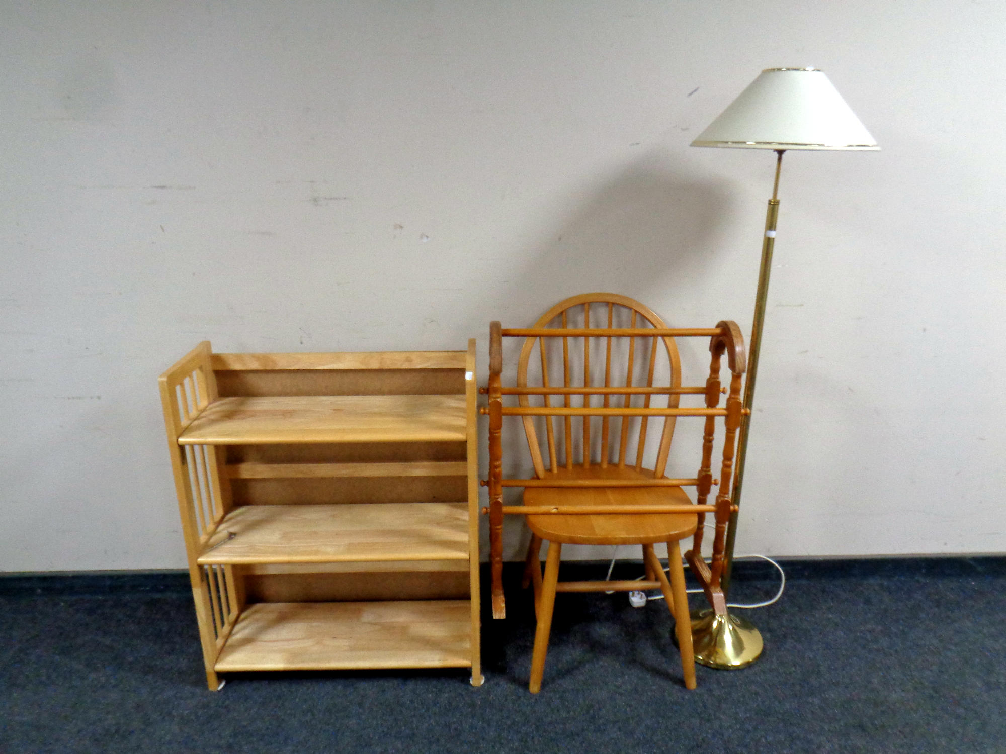 A set of folding pine shelves together with a spindle back chair,