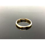An 18ct yellow gold band ring, 2.1g, size J/K.