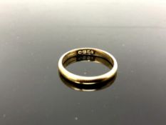 An 18ct yellow gold band ring, 2.1g, size J/K.