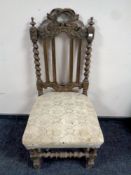 An antique carved oak dining chair (Af)