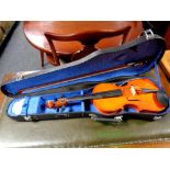 A Chinese violin and bow in case