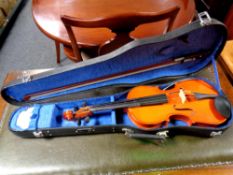 A Chinese violin and bow in case