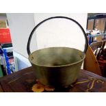 A brass cast iron handled jam pan
