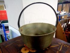 A brass cast iron handled jam pan