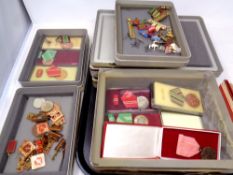 A quantity of Eastern European medals and badges in seven plastic storage boxes