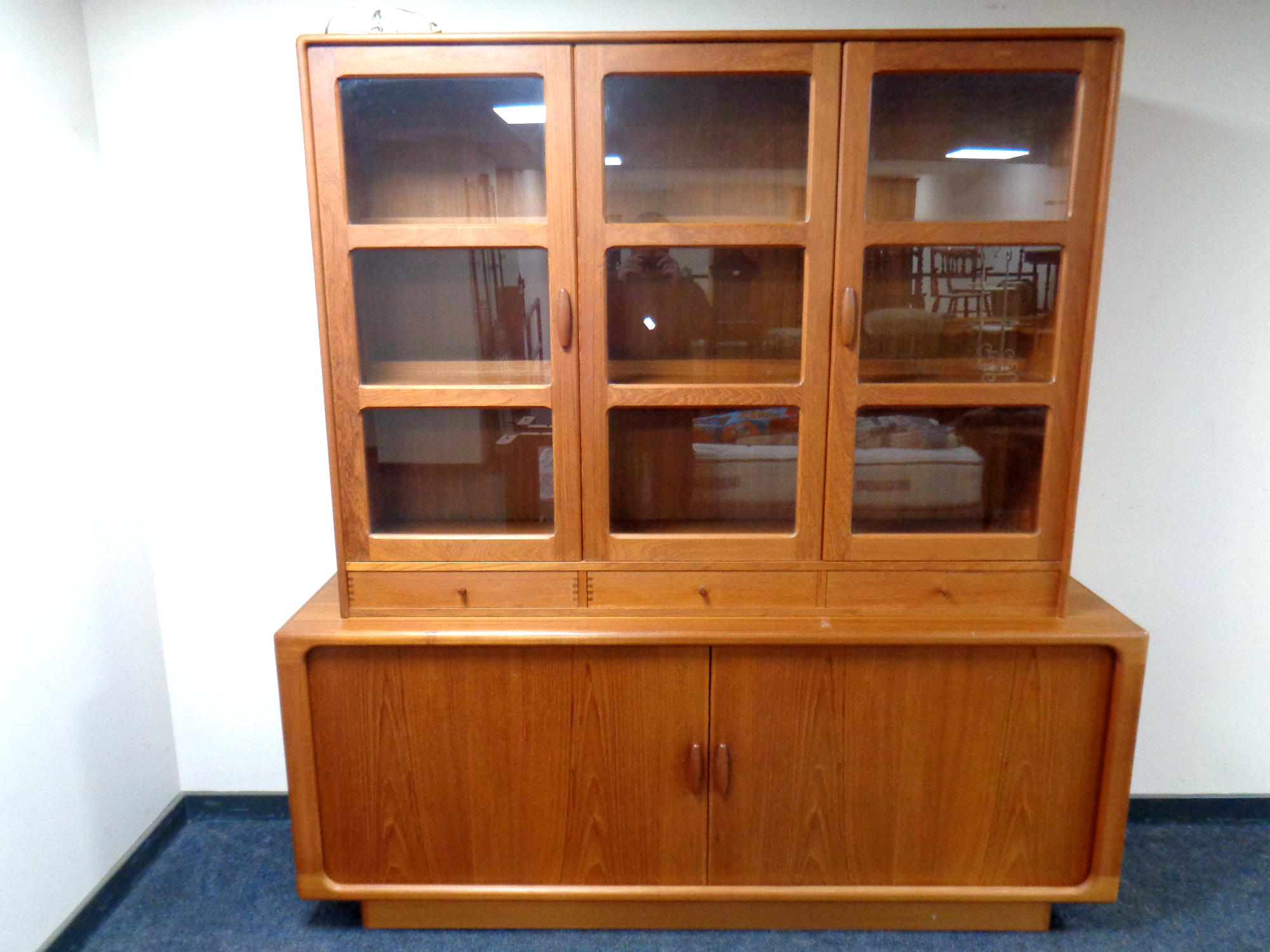 A mid 20th century Dyrlund Danish double door sideboard with shutter doors and triple glazed door