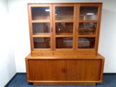 A mid 20th century Dyrlund Danish double door sideboard with shutter doors and triple glazed door