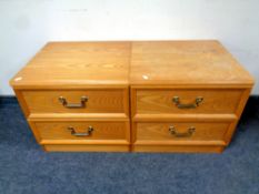 A pair of teak G-plan two drawer bedside chests, width 50 cm.