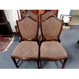 A set of four mahogany shield backed chairs