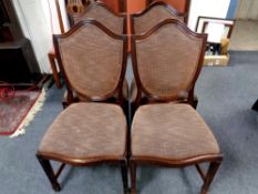 A set of four mahogany shield backed chairs