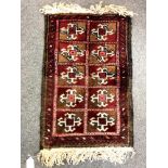 A small Afghan woolen rug