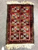 A small Afghan woolen rug