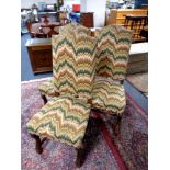 A set of three oak high backed dining chairs upholstered in tapestry fabric