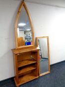 A set of pine open bookshelves together with two framed mirrors