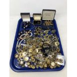 A tray of various costume jewellery, tie pins, cuff links, brooches,