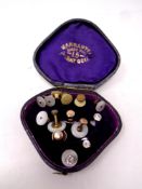 An antique box containing collar studs,