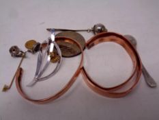 A quantity of copper bracelets, costume jewellery,