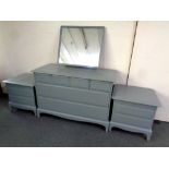 A Stag Minstrel six drawer dressing chest and a pair of two drawer bedside chest (painted) no