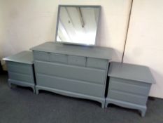 A Stag Minstrel six drawer dressing chest and a pair of two drawer bedside chest (painted) no