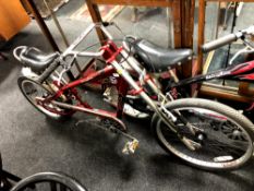 An Schwinn Stingray bike in the form of a chopper, red.