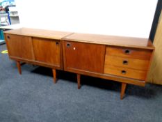 A mid 20th century teak sliding door sideboard fitted three drawers together with matching double