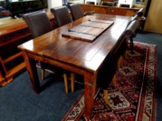 A sheesham wood extending dining table with leaf, length 225 cm,