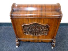 An early Victorian rosewood dome topped music cabinet, fitted divider within,