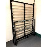 A 4'6 contemporary metal bed frame