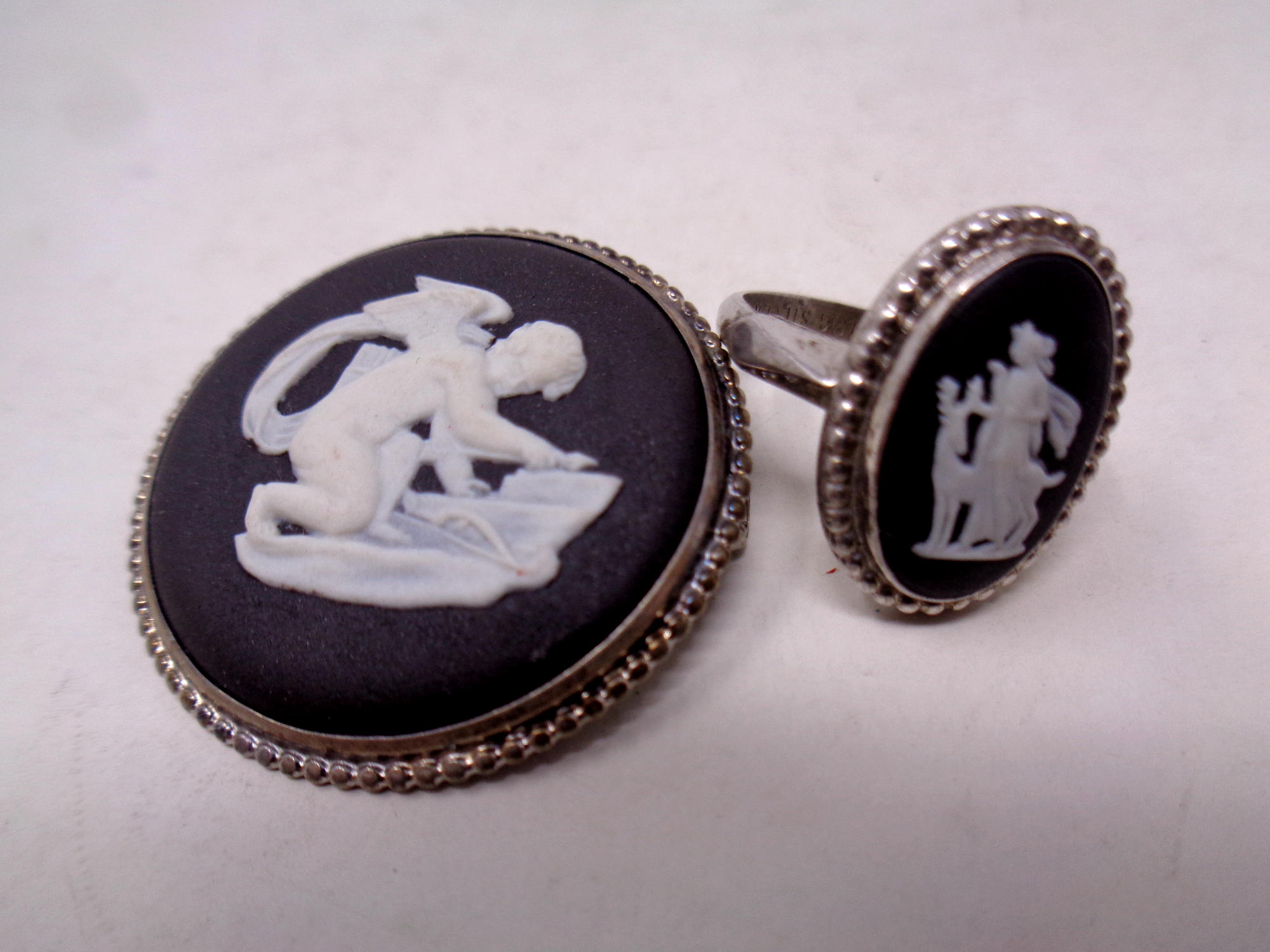 Two black Wedgwood pieces of jewellery - brooch and a ring