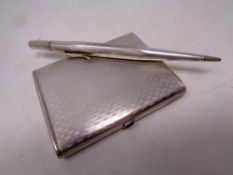 A silver card case together with propelling pencil