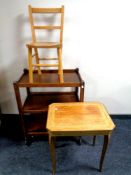 An oak three tier trolley together with a child's chair and an Italian style musical work table