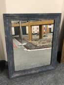 A modern mirror in blue tone frame