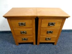 A pair of contemporary oak three drawer bedside chests, width 41.